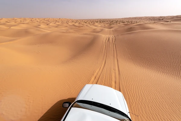 Four-wheel-drive vehicle crossing the steep dunes of Liwa and the Empty Quarter