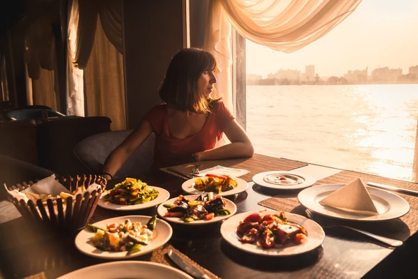 Dhow cruise dinner with views of the marina skyline at night