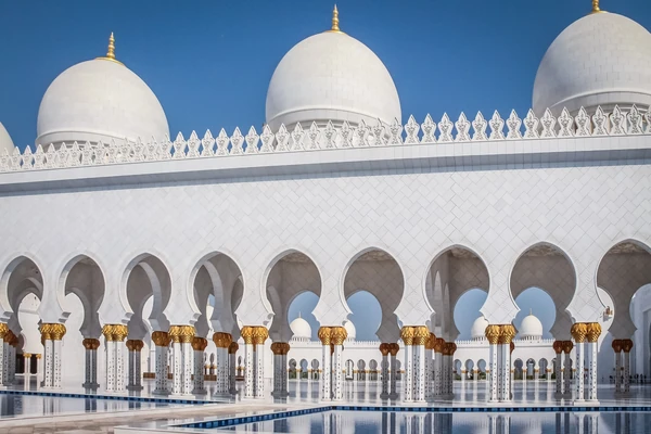 White arches and domes of Sheikh Zayed Grand Mosque in Abu Dhabi